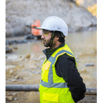 Image of a Man on Construction Site Wearing Safety Goggles, Safety Vest, and a Hard hat  