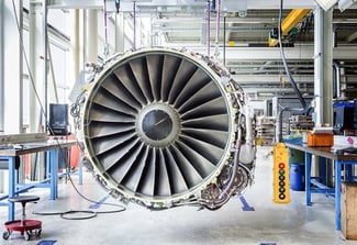 Image showing a jet engine with a control pendant being repaired.