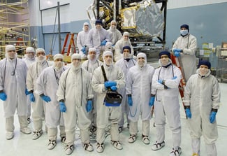 Image of large group of people in full sanitary gear