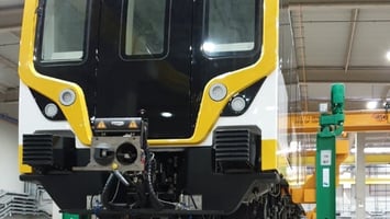 Image of Train Being Lifted By Crane System