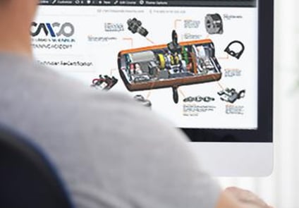 Image of person looking at computer screen with CMCO equipment on screen