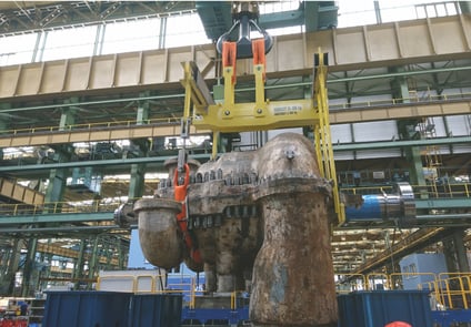 Teaser image showing heavy turbines carefully moved with industrial slings, highlighting precision and safety in heavy industry.