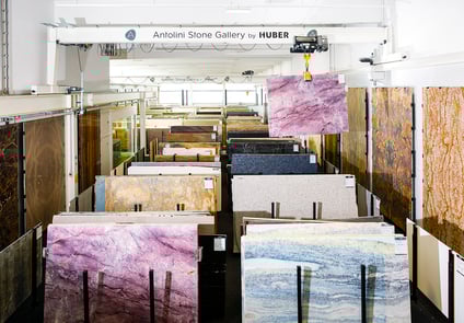 Industrial manufacturing environment featuring Stahl CraneSystems overhead lifting equipment.