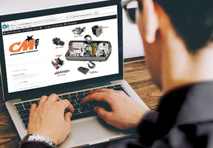 Image of man on computer taking CM online training course