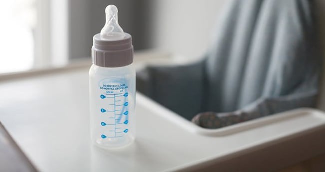 Image of an empty baby bottle on countertop