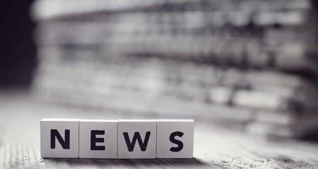 Black and White Image of Letter Blocks spelling out NEWS