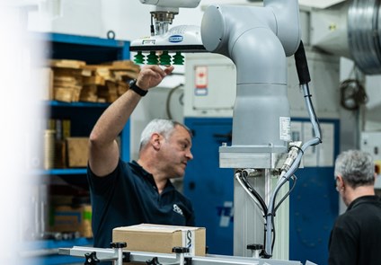 Robotic lifting column designed to raise and position heavy components with precise, automated vertical motion.