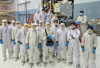 Image of large group of people in full sanitary gear